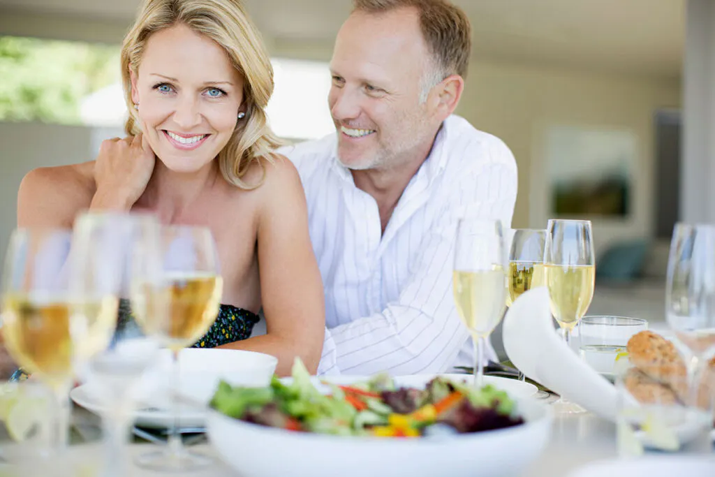 Woman and Man Eating and Drinking